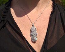 Load image into Gallery viewer, Close-up of a person wearing an Antique Platinum and Diamonds Pendant Necklace/Brooch wearing a black top.