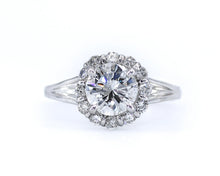 Load image into Gallery viewer, Front view of a white gold Verragio engagement ring featuring a GIA certified round brilliant-cut center diamond surrounded by a diamond halo, with a split shank set on a white background.