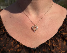 Load image into Gallery viewer, Diamond Cluster Heart Pendant worn around a neck.