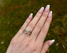 Load image into Gallery viewer, Shared Prong Graduated Diamond Wedding Band paired with a Round Diamond Engagement Ring
