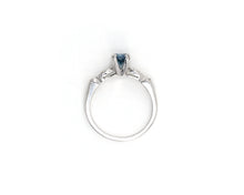 Load image into Gallery viewer, Vintage platinum ring set in the center with a color enhanced fancy blue round diamond, with white diamond side stones.