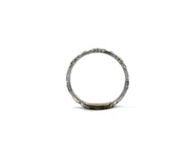Load image into Gallery viewer, 14K white gold wedding band featuring beautifully carved flowers in an eternity style.