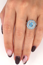 Load image into Gallery viewer, 10k white gold, blue topaz and white sapphire halo cocktail ring
