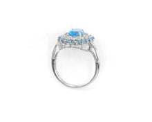 Load image into Gallery viewer, 10k white gold, blue topaz and white sapphire halo cocktail ring.