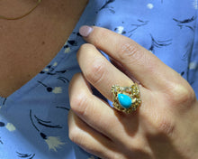 Load image into Gallery viewer, 14K Yellow Gold Ring Set With Synthetic Turquoise And Diamonds On a Hand.
