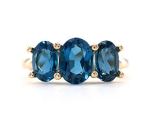 Load image into Gallery viewer, 14k yellow gold and London blue topaz three stone ring.