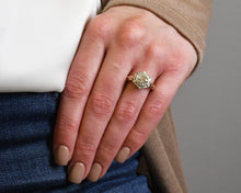 Load image into Gallery viewer, Antique 14K yellow and white gold ring set with a round brilliant cut diamond.
