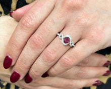 Load image into Gallery viewer, 18K white gold oval ruby and diamond ring modeled on hand.
