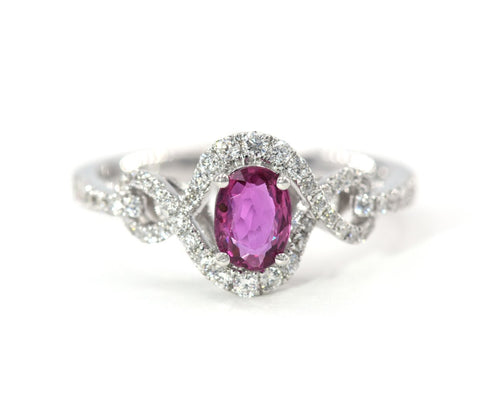 18K white gold oval ruby and diamond ring.