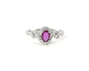 18K white gold oval ruby and diamond ring.