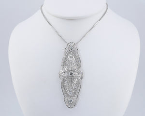 Antique Edwardian platinum diamond brooch, worn on a chain (sold separately).