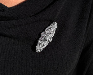 Antique Edwardian platinum diamond brooch on a black shawl.
