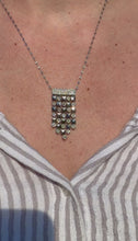 Load and play video in Gallery viewer, A video of Estate Checkerboard Tassel Diamond Dangler Necklace on a neck.
