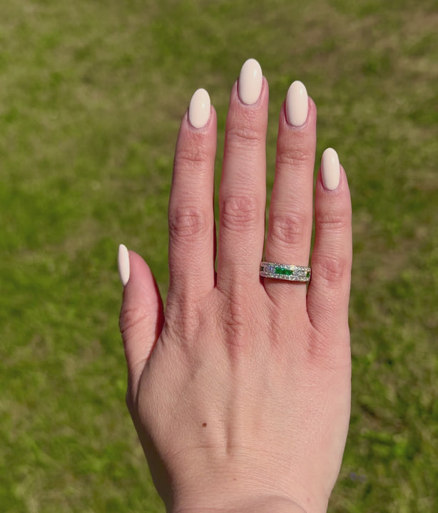 Emerald And Diamond Ring On A Hand In A Video.