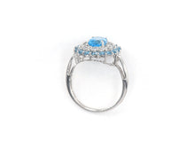 Load image into Gallery viewer, 10k white gold, blue topaz and white sapphire halo cocktail ring.
