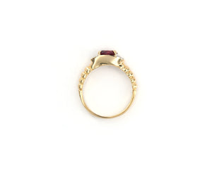 14K yellow gold pink tourmaline and diamond ring.