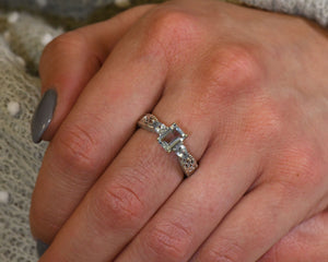 14K white gold and Aquamarine ring worn on hand.