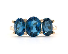 Load image into Gallery viewer, 14k yellow gold and London blue topaz three stone ring.
