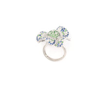 Load image into Gallery viewer, 18K white gold diamond, blue sapphire, and green garnet flower cocktail ring.

