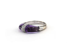 Load image into Gallery viewer, This 18k white gold statement ring features two fancy-shaped cabochon cut amethyst separated by a dome of pave diamonds.
