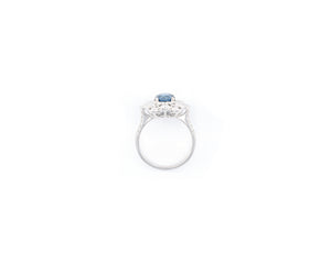 18K white gold fancy blue and white diamond flower ring.