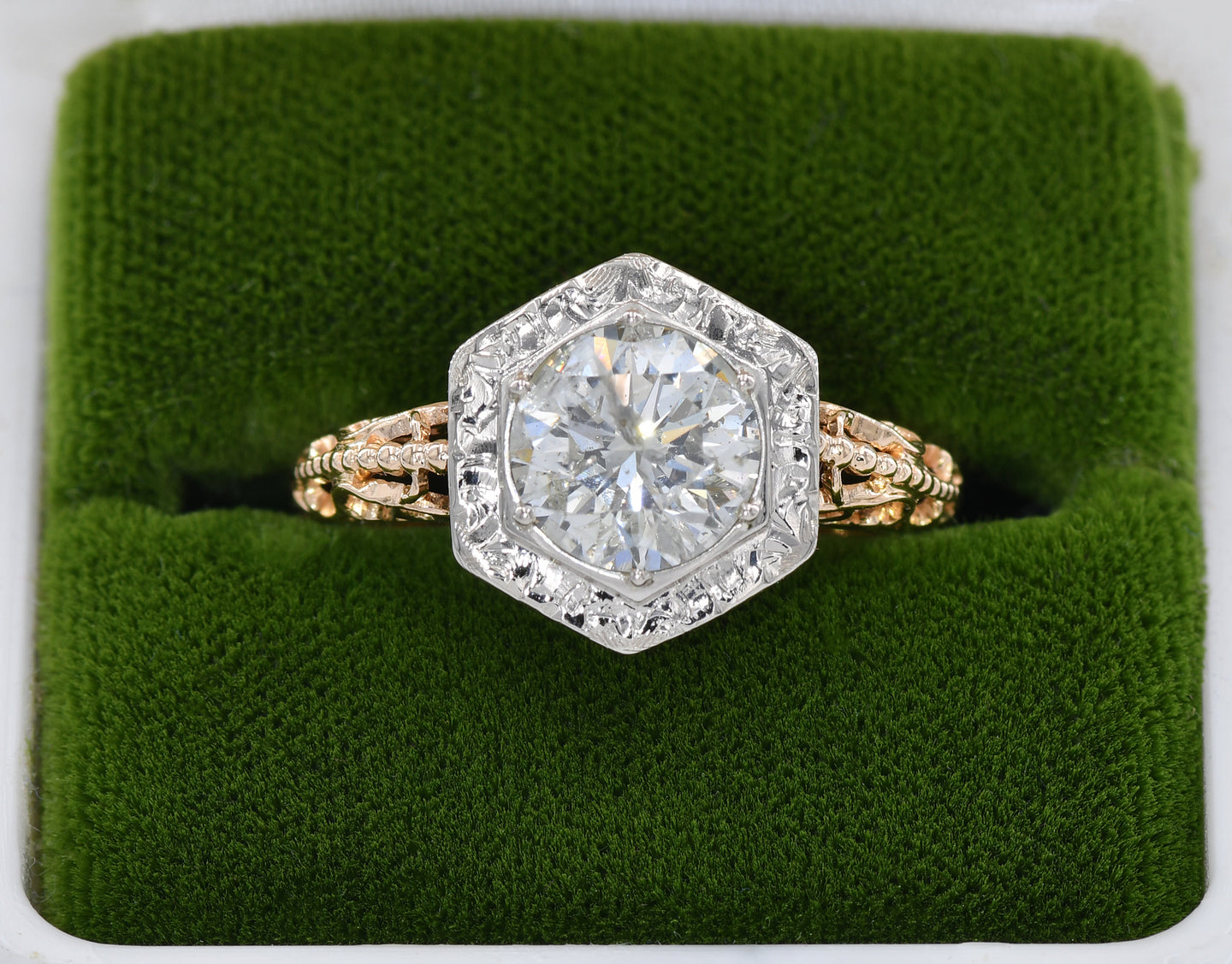 Antique 14K yellow and white gold ring set with a round brilliant cut diamond.