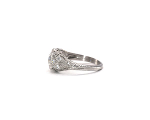 Antique platinum ring set with a GIA certified round brilliant cut diamond.
